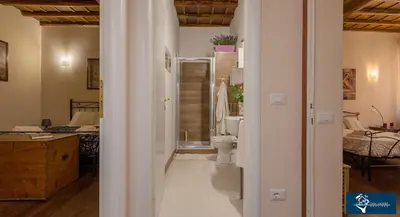 a bathroom with a shower and a toilet in it at L'Olimpo di Estia in Rome
