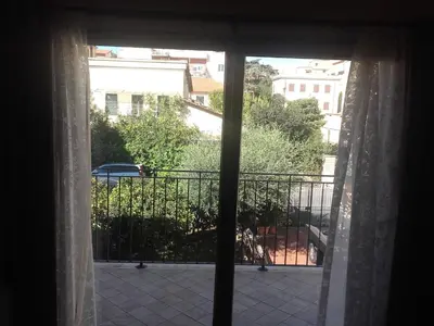 an open window with a view of a balcony at Casa Rosa in Rome