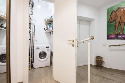 a laundry room with a washer and dryer at Interno 9 a San Pietro in Rome