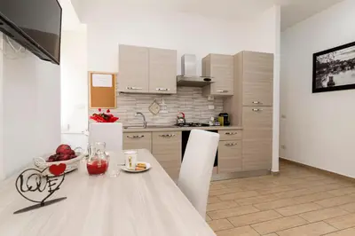 a kitchen with a table with a plate of food on it at Amor Vatican Domus in Rome