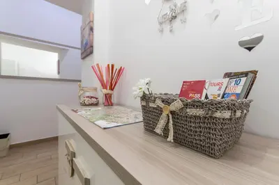 a room with a counter with books and a basket at Amor Vatican Domus in Rome