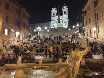 a group of people sitting on the steps of a building at Amor Vatican Domus in Rome