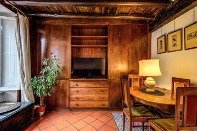 a living room with a tv and a wooden wall at Magenta Collection Egidio in Rome