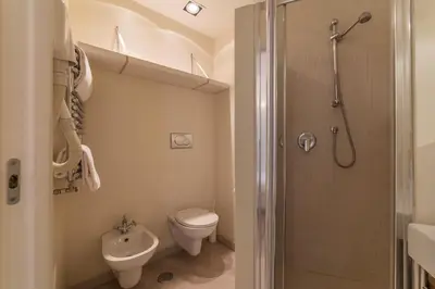 a bathroom with a toilet and a shower at Nina Casetta De Trastevere in Rome