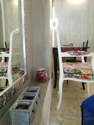 a room with two chairs and a mirror at Casa Tua a Piazza del Popolo in Rome