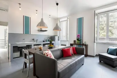 a living room with a couch and a table at Residenza Termini in Rome