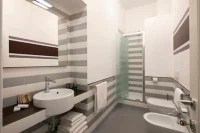 a bathroom with a sink and a toilet at Residenza Termini in Rome