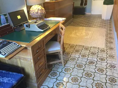 an office with a desk with a computer on it at Hotel Touring in Rome