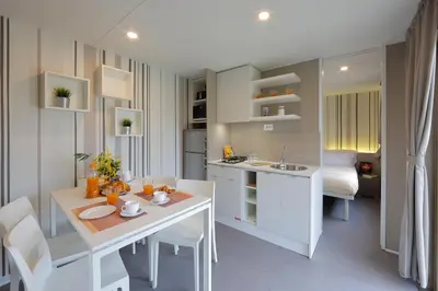 a kitchen and dining room with a table and chairs at hu Roma Camping In Town in Rome