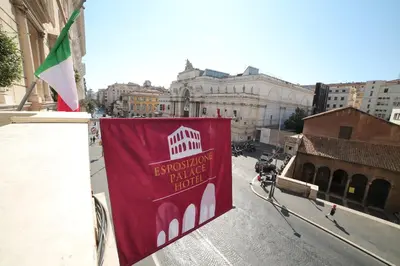 a red banner on the side of a building at Esposizione Palace Hotel in Rome