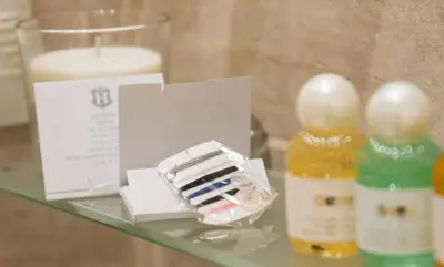 a glass table with a box of eggs and a brush at Esposizione Palace Hotel in Rome