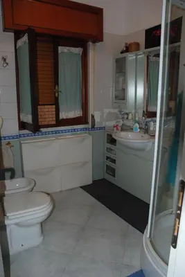 a bathroom with a toilet and a sink and a shower at Anna Vì Guest Home in Rome