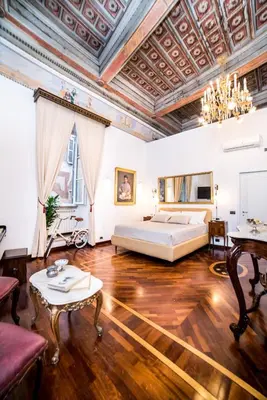 a bedroom with a bed and a coffered ceiling at Palazzo Del Duca Piazza Navona Campo dei Fiori Piazza del Fico Guest House in Rome