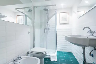 a bathroom with a toilet and a sink and a shower at Palazzo Del Duca Piazza Navona Campo dei Fiori Piazza del Fico Guest House in Rome