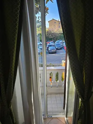 an open window with a view of a parking lot at Sourire Hotel in Rome