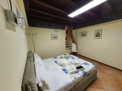 a bedroom with a bed in a room at Campo Marzio Exclusive Maison in Rome