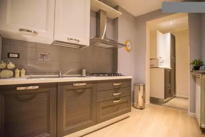 a bathroom with a toilet and a sink at Happy House Rienzo in Rome