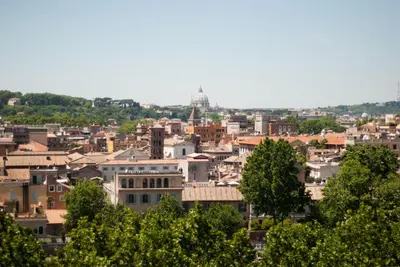 a cityscape of a city with buildings and trees at Trastevere classico self check in in Rome