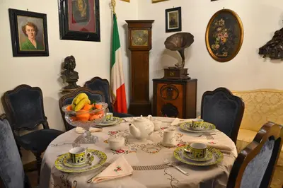 a dining room table with a bowl of fruit on it at B&B Domus Piazza del Popolo in Rome