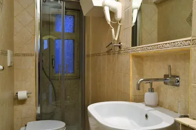 a bathroom with a toilet and a sink and a shower at B&B Domus Piazza del Popolo in Rome
