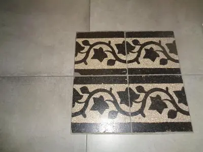 a tile floor with a rug on a floor at T C RMs in Rome