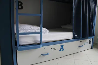 a bunk bed with a mattress and a pillow on it at Roma Scout Center in Rome