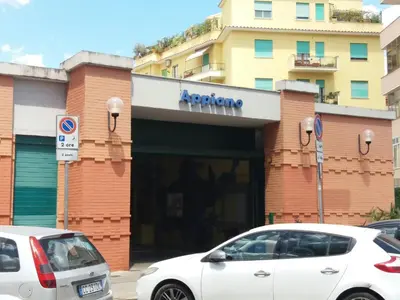 two white cars parked in front of a building at Priscilla's inn in Rome