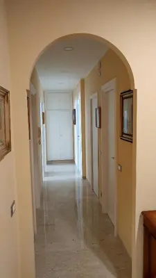 an empty hallway with an archway in a house at Vatican69 New Apartment in Rome