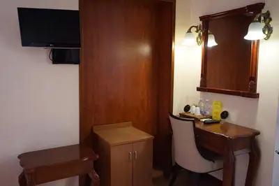 a small room with a desk and a chair at Hotel Filippo in Rome