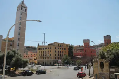 a city street with cars parked in a parking lot at St. Anthony Guest House in Rome