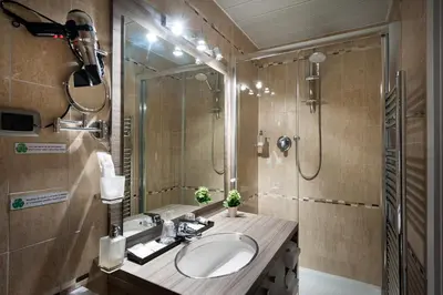 a bathroom with a sink and a shower at Morrisson Exclusive Rooms in Rome