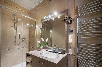 a bathroom with a sink and a shower at Morrisson Exclusive Rooms in Rome