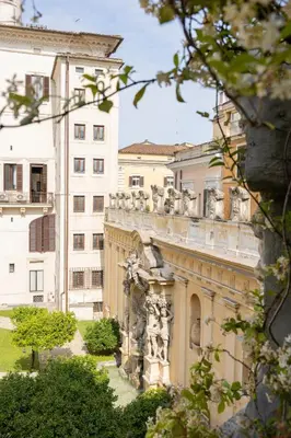 a building with statues on the side of it at Hotel Vilòn - Small Luxury Hotels of the World in Rome