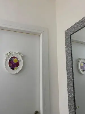 a mirror on a wall next to a door at Rome Sweet Home Vatican in Rome