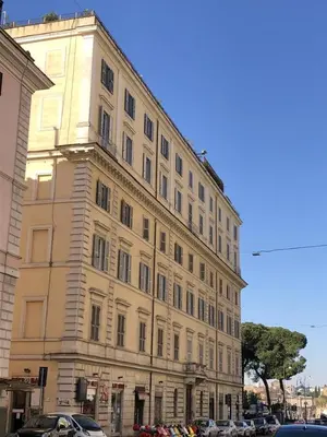 a large building with cars parked in front of it at Hotel Labelle in Rome