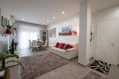 a living room with a couch and a table at M&M House in Rome