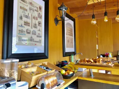 a kitchen with a table with a tray of food at Navona Residenza de Charme in Rome