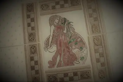 a painting of a woman on a wall at San Peter's Golden Rooms in Rome