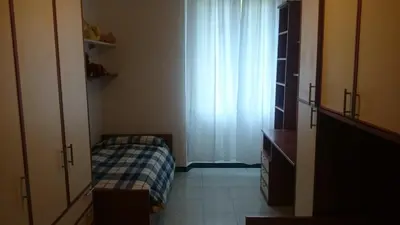 a small bedroom with a bed and a window at Double room da Giulio in Rome