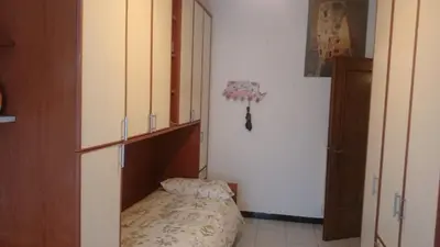 a small room with a bed and a closet at Double room da Giulio in Rome