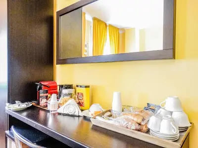 a table with food on it with a mirror at B&B Morelli 1 in Rome