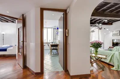 a hallway with a room with a bed and a table at Rome as you feel - Panisperna Apartment in Rome