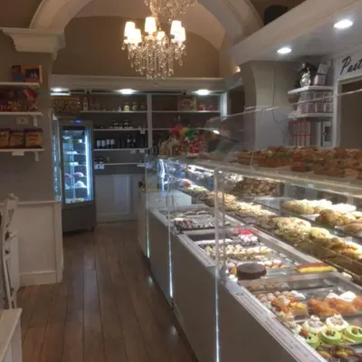 a bakery with a bunch of pastries on display at Piazza Cavour Suite in Rome