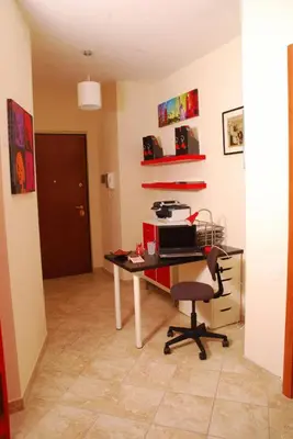 a room with a desk with a computer and a chair at Stefy's Rooms in Rome