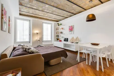 a bedroom with a bed and a table and a desk at Piazza Navona-Coronari House in Rome