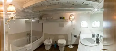 a bathroom with a tub and a toilet and a sink at Behind Navona in Rome