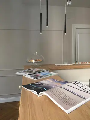 a table with an open magazine on top of it at Palazzo Baj in Trastevere in Rome