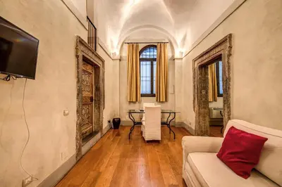 a living room with a couch and a table at Magenta Collection Specchi in Rome