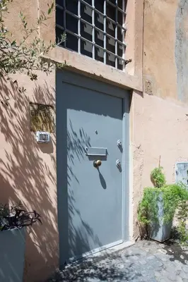 a door with a handle on the side of a building at Secret Rhome Loft in Rome