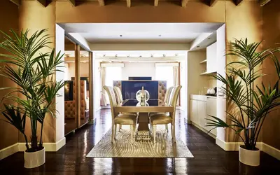 a dining room with a table and chairs at LE RÊVE DE NAIM Roma in Rome